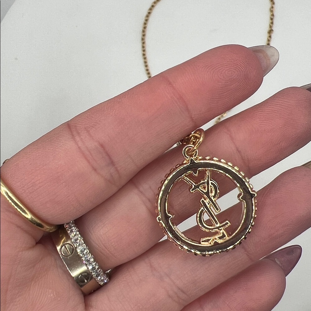 868. Elegant Gold YSL Pendant on 18” gold plated chain. - Picture 4 of 8